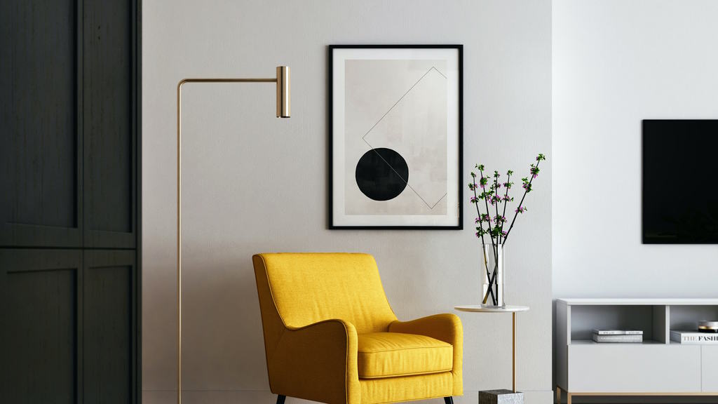Ein Sessel steht vor einem Akustikbild an der Wand
